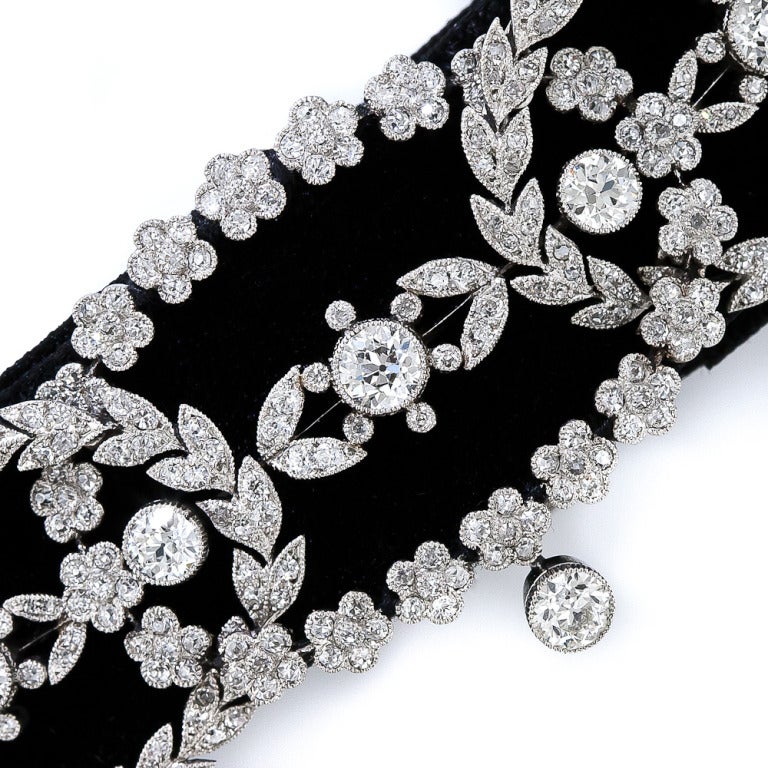 A rare and regal original Belle Époque diamond choker - or 'dog collar' - necklace, masterfully handcrafted in platinum - circa 1900. Three intersecting oval wreaths fashioned in flower and leaf motifs are gently curved to closely caress your neck.