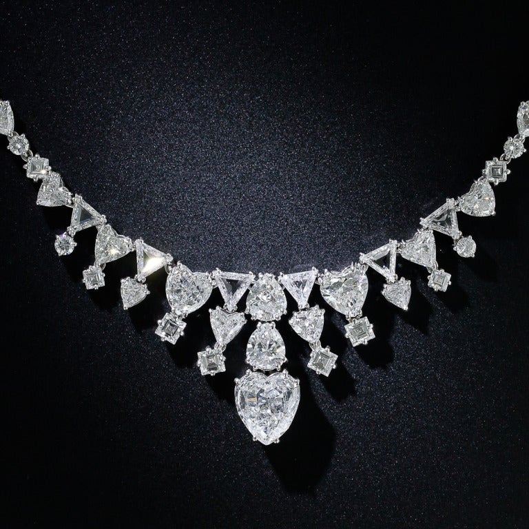 30 carats of Cupid's favorite diamond cuts join forces to form this divinely glamorous, one-of-a-kind platinum necklace evoking the screen goddess style of Grace Kelly and Elizabeth Taylor. Starring a gorgeous F color 2.75 carat heart-shaped diamond