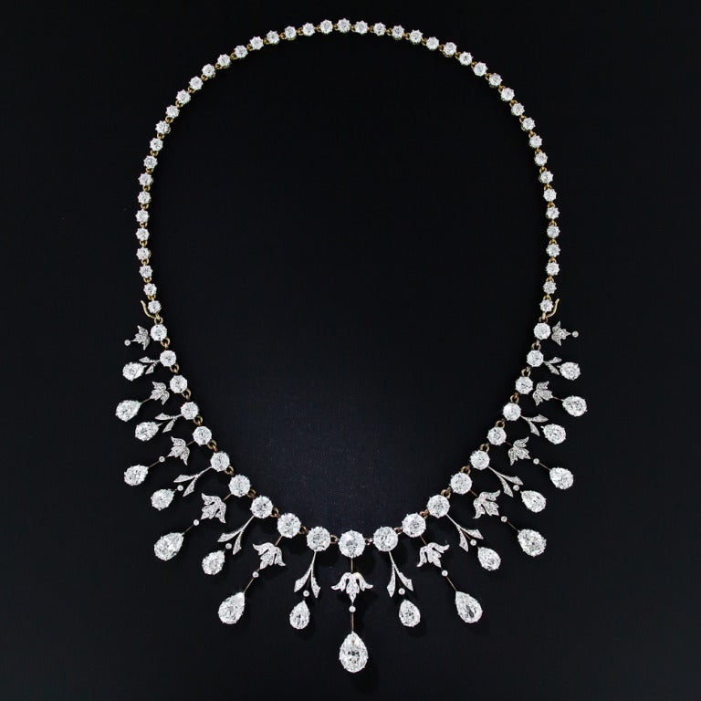 We are thrilled to present this rare, regal and altogether sublime antique diamond necklace. A masterpiece of Edwardian craftsmanship - circa 1900 - hand-fabricated in platinum over 18 karat gold, with almost 35 carats of well-matched, bright-white