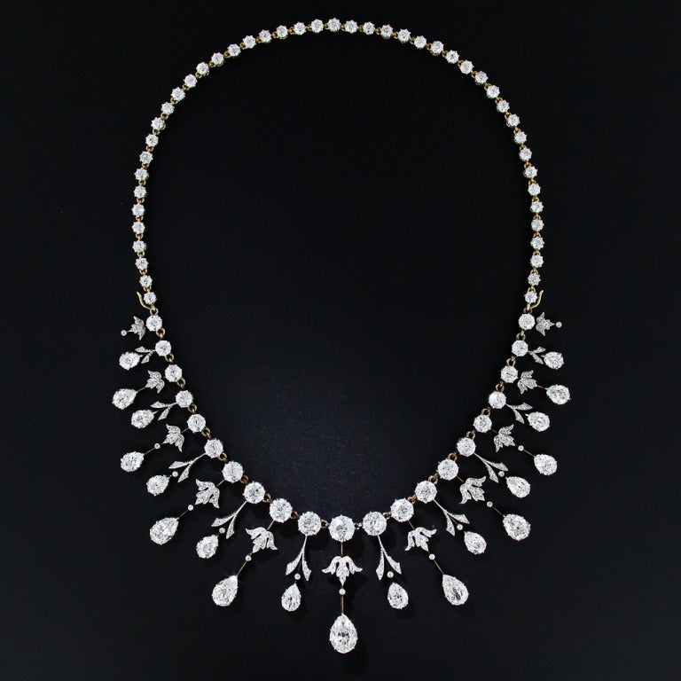 We are thrilled to present this rare, regal and altogether sublime antique diamond necklace. A masterpiece of Edwardian craftsmanship - circa 1900 - hand-fabricated in platinum over 18 karat gold, with almost 35 carats of well-matched, bright-white