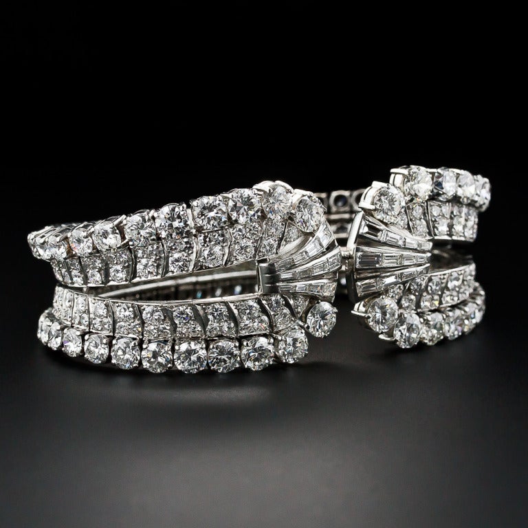 A spectacular, singular and showstopping diamond bracelet with an exotic pedigree. Twenty-eight carats of bright-white and sparkling round diamonds culminate in the center with sprays of baguettes and is masterfully handcrafted in platinum with