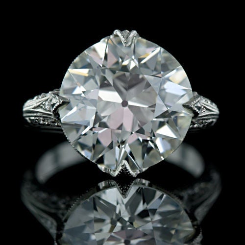 A stunningly beautiful 7.92 carat old European cut diamond is presented in a gorgeous platinum mounting expertly crafted in the Edwardian style by one of our finest jewelers. The diamond, which due to its cut appears larger and much whiter than the