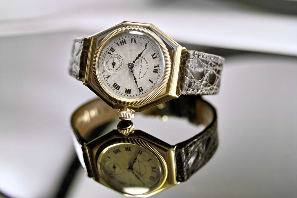 A Gold Octagonal Wristwatch. Oyster, 1923<br />
18K, nickel lever movement, 15 jewels, bi-metallic cut compensation balance, timed to 6 position for all climates, precision regulator, two tone silvered dial, applid Arabic numerals, blue steel