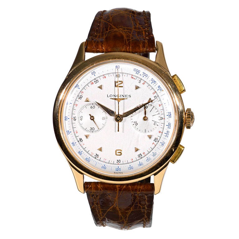 LONGINES. A gentleman's pink gold chronograph wristwatch