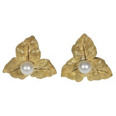 Gold and cultured pearl earclips, by Mario Buccellati