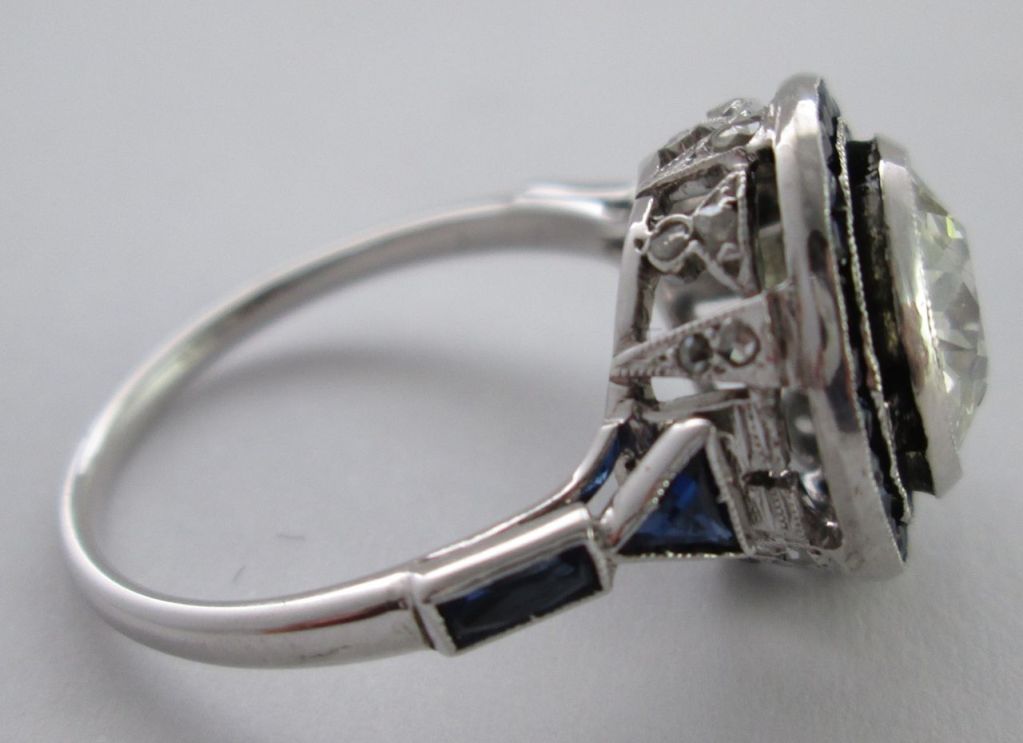 Edwardian An early 20th Century Platinum, Diamond and Sapphire cluster Ring