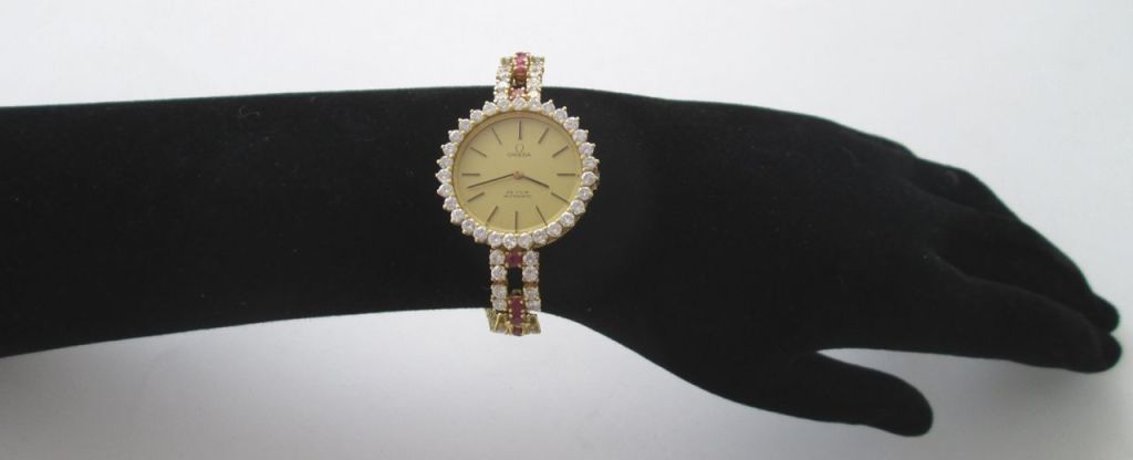 Omega Lady's Yellow Gold, Diamond and Ruby De Ville Bracelet Watch In Excellent Condition In Firenze, IT