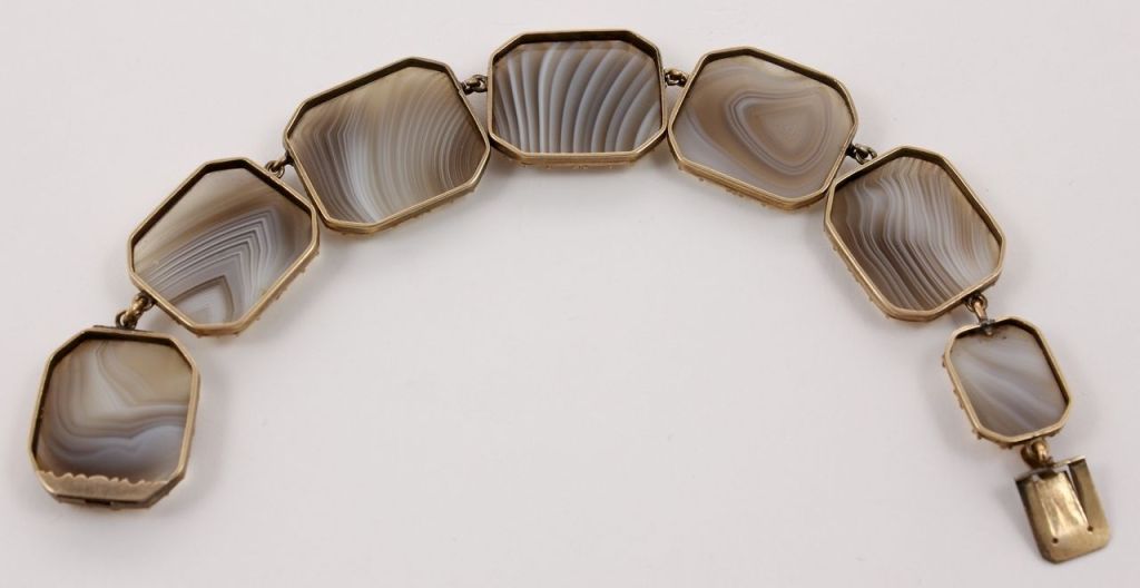 PLEASE NOTE: OUR PRICE IS FULLY INCLUSIVE OF SHIPPING, IMPORTATION TAXES & DUTIES

composed of rectangular panels, set with seven agates

18.5 cm long