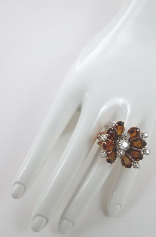 Disigned as a stylized butterfly with quartz citrine wings and old cut diamond body

Size 7

Weight 15.1 gr.
