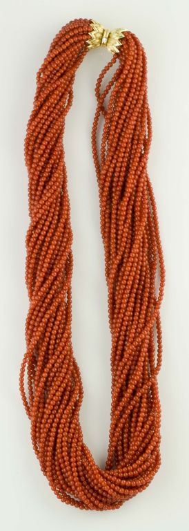 Impressive and bold multi strand coral bead necklace with 18k yellow gold and diamond clasp, by Tiffany & Co. Schlumberger.  This distinct and bold necklace features 23 strands of rich red coral beads of 3mm width; the clasp features a single 0.05