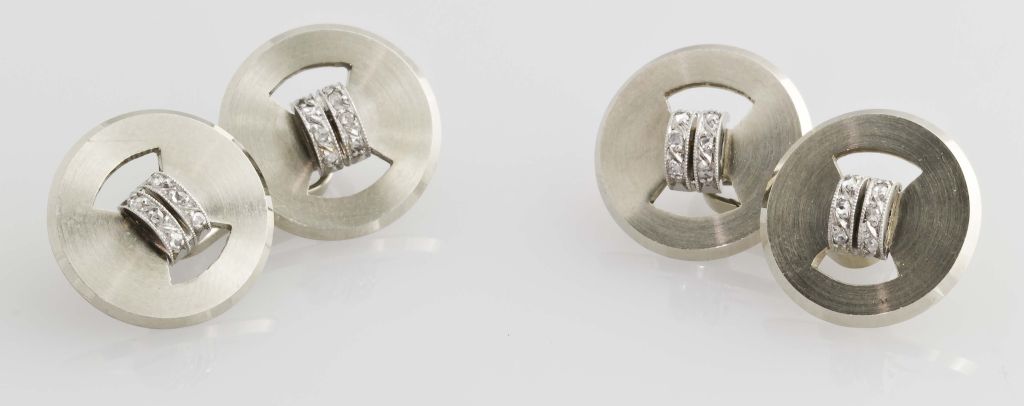 Handsome and elegant 18K white gold, platinum and diamond cufflinks, by Marshak. These feature a smooth round finish with two rows of round cut diamonds in the middle, set in platinum. These are part of our extensive collection of rare and unusual