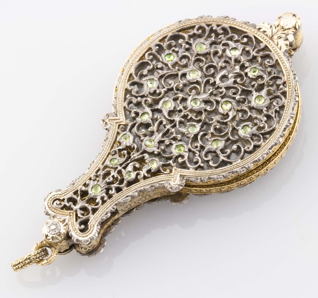 intage and very rare 18k white and yellow gold lorgnette set with peridots, by Mario Buccellati.  This wonderful item can be used as an interesting and useful pendant to a necklace for the lady that has a more unusual and distinct style.