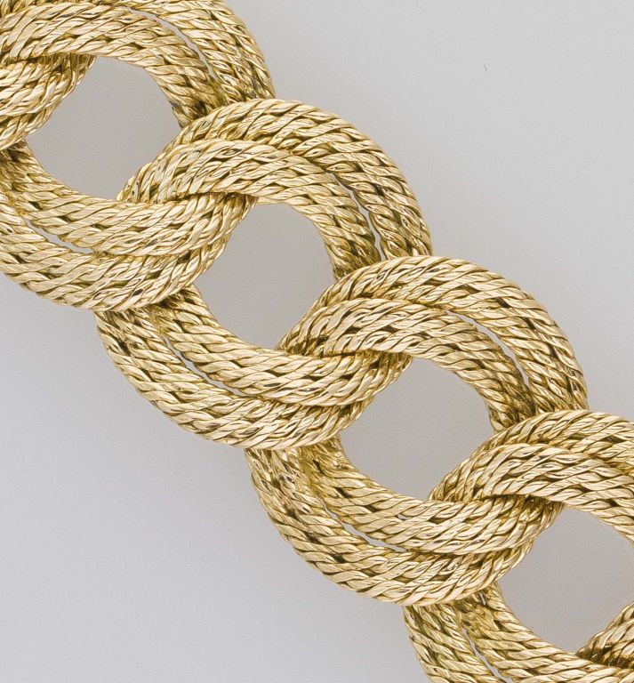 Bold and impressive 18K yellow gold braided link bracelet by Tiffany France, circa 1960s. It features a braided rope-like textured design to each interlocking link. <br />
Hallmarks: Tiffany & Co., 18Kts, France (marks are faint but visible).
