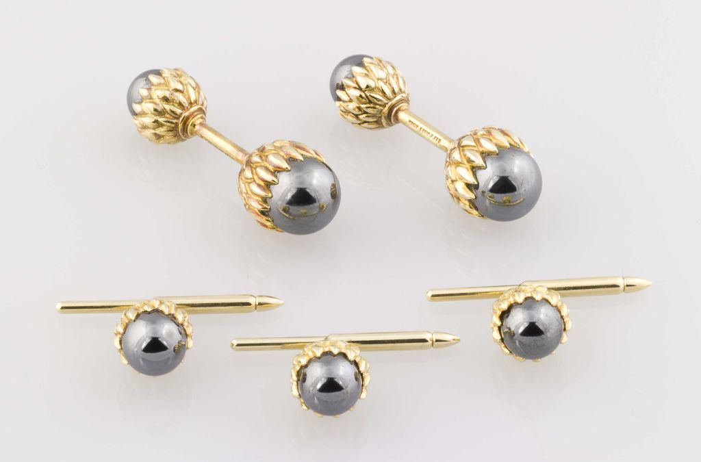 Contemporary 18K yellow gold and hematite sphere cufflink and stud set by Tiffany & Co. Schlumberger. The design of these cufflinks is known as 