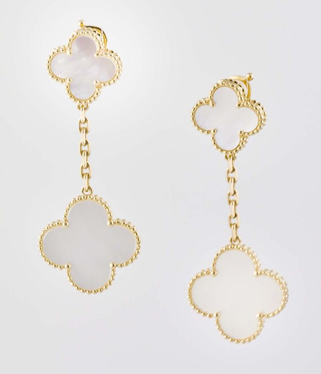Pretty 18k yellow gold and mother-of-pearl drop earrings, from the Alhambra collection by Van Cleef & Arpels.  The earrings feature two cloves, one slightly larger than the other.  Marked 