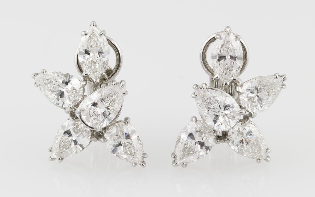 Important diamond cluster earrings by Harry Winston. They feature 10 diamonds of pear and marquise cut for approx. 8.00 total carat weight, F-G color VS clarity range. Set in platinum. <br />
Hallmarks: HW (Harry Winston maker's mark), PT950.