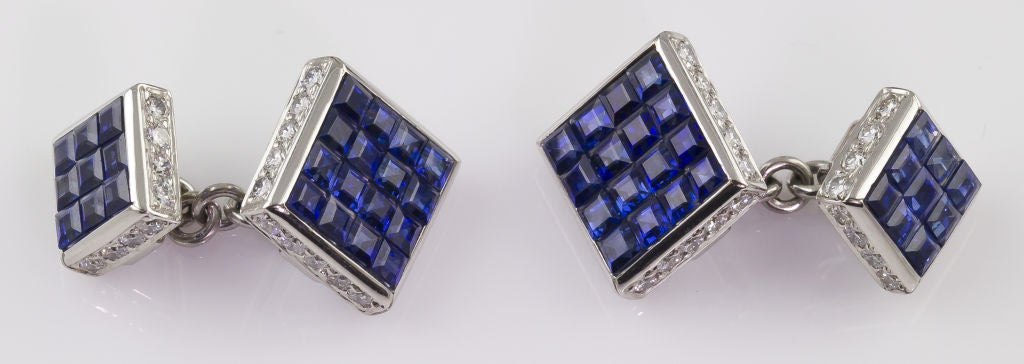Handsome and impressive cufflink and stud set by Aletto Brothers. It consists of a pair of cufflinks and 3 shirt studs. Each item of the set is expertly set with invisible set calibre cut sapphires, along with high quality round brilliant cut
