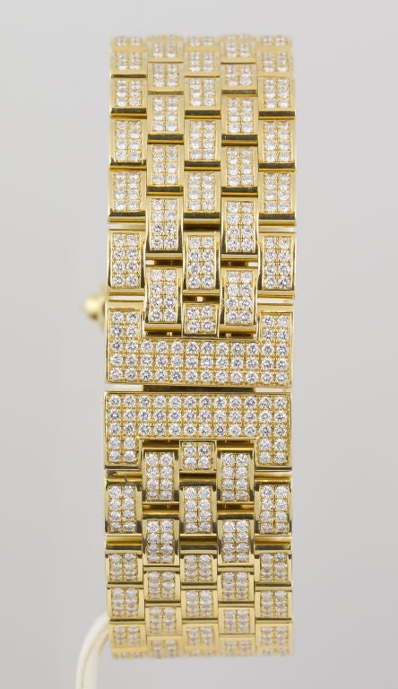 Important 18K yellow gold and diamond ladies wrist watch by Chaumet. It features a brick-like bracelet and is extremely comfortable because it contours very well with anyone's wrist. Set with brilliant high-grade round cut diamonds of approx.
