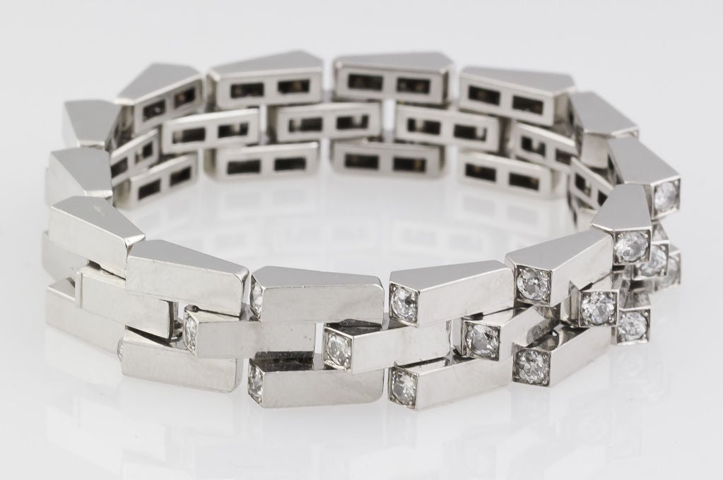 Extremely rare and unusual platinum and diamond art deco escalator bracelet by Boucheron, circa 1915-1920s. This piece is known as an escalator bracelet because the links are ascending and flexible and resemble an actual escalator in the way that
