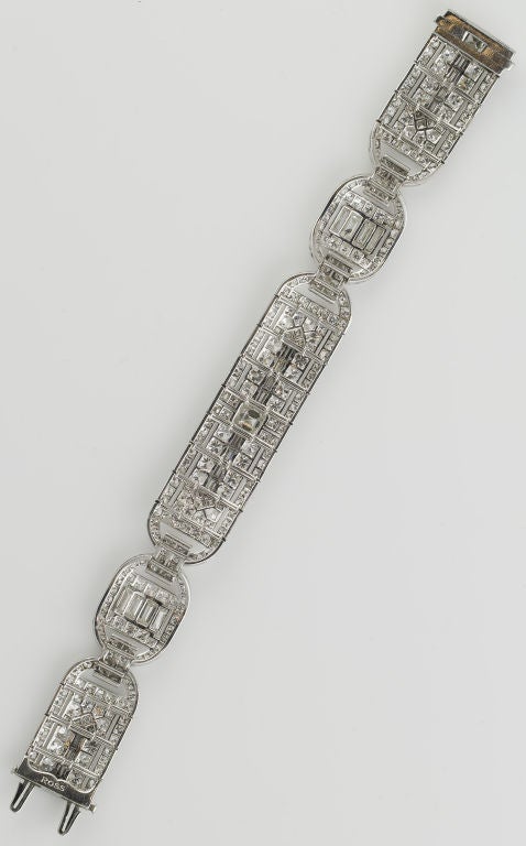 Exquisite and very rare platinum and diamond bracelet, by Ross, circa 1935.  A magnificent period piece featuring over 20.5cts of very high quality baguette cut, round brilliant cut, and square step cut diamonds.  Extremely well made, with a nice