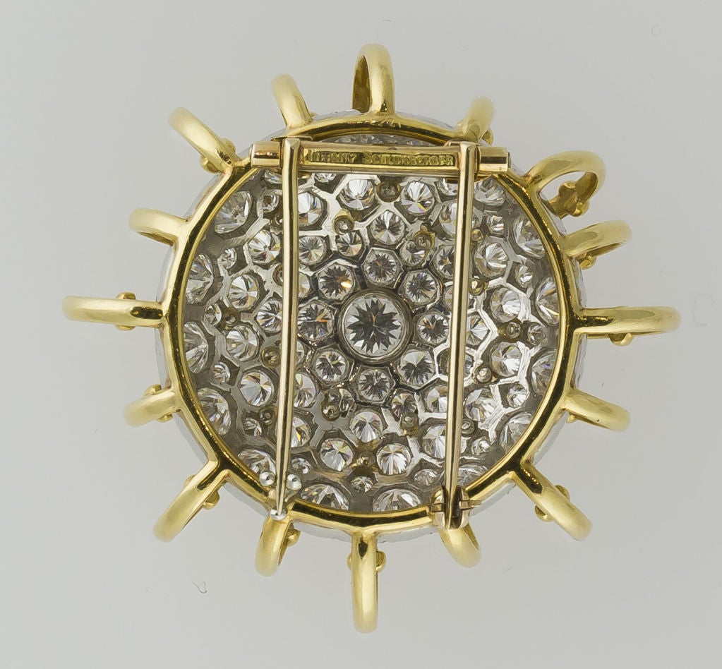 Rare and unusual 18k yellow gold and platinum diamond circular brooch from the 