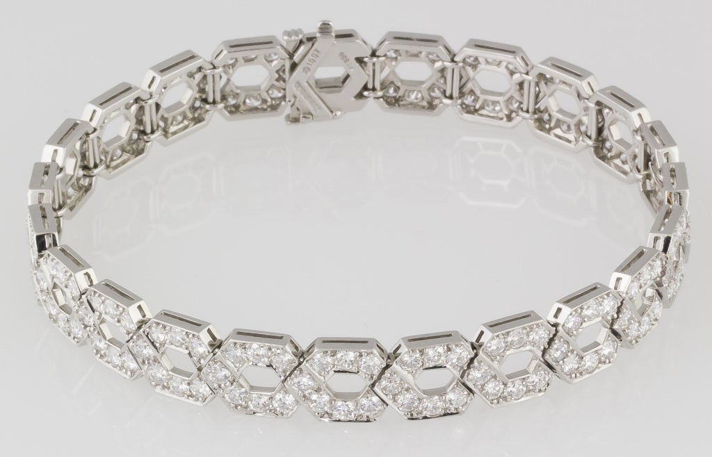 Brilliant platinum and diamond link bracelet by Tiffany & Co., circa 1997. Designed as a geometric pattern of repeating hexagons, it is reminiscent of early Art Deco styles.  It features approx. 10.0cts of high grade brilliant round cut diamonds.<br