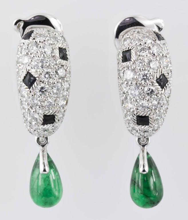 Elegant 18K white gold, diamond, onyx and emerald earrings from the 