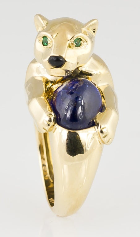 Highly collectible 18K yellow gold, sapphire, emerald and onyx ring from the 