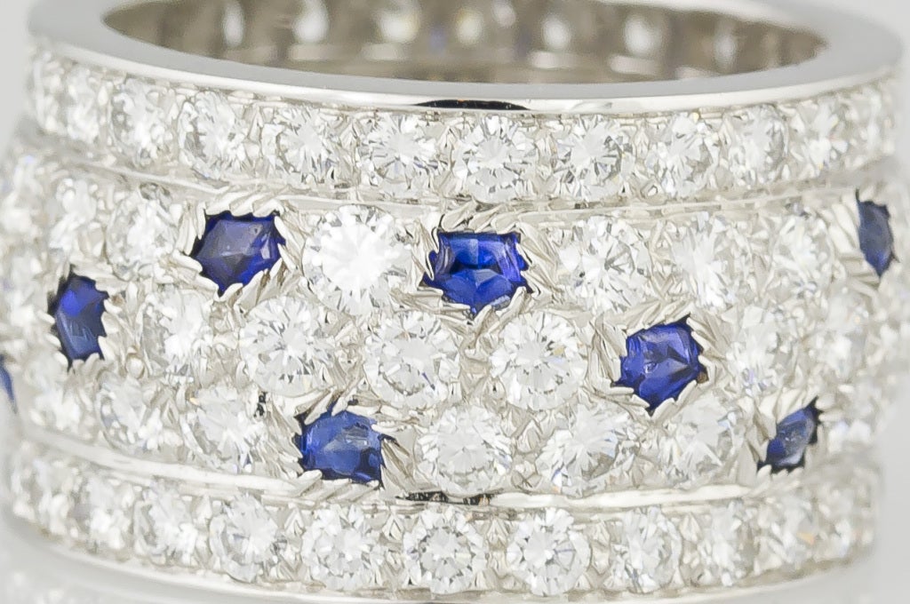 Striking and rare 18K white gold, diamond and sapphire wide band ring from the 