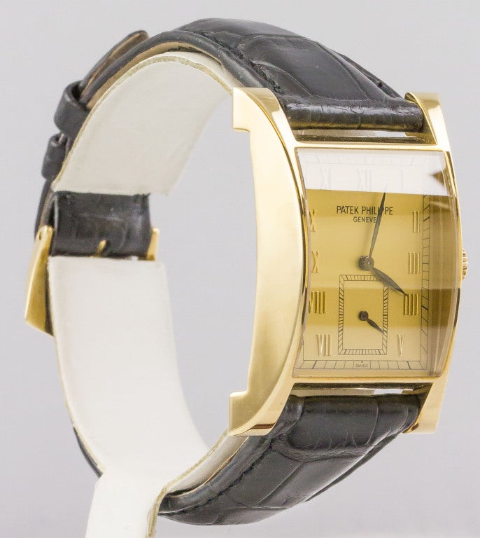 Elegant and masculine Patek Philippe 18K yellow gold commemorative Pagoda wristwatch, Ref. 5500J, limited to 1100 examples in yellow gold and made in 1997. It features a case, crown, and lugs made from a solid 18K yellow gold. The solid snap back