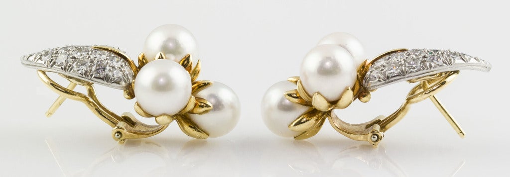 Charming and unusual 18K yellow gold, diamond and pearl earrings from Tiffany & Co. Schlumberger. They are referred to as the 