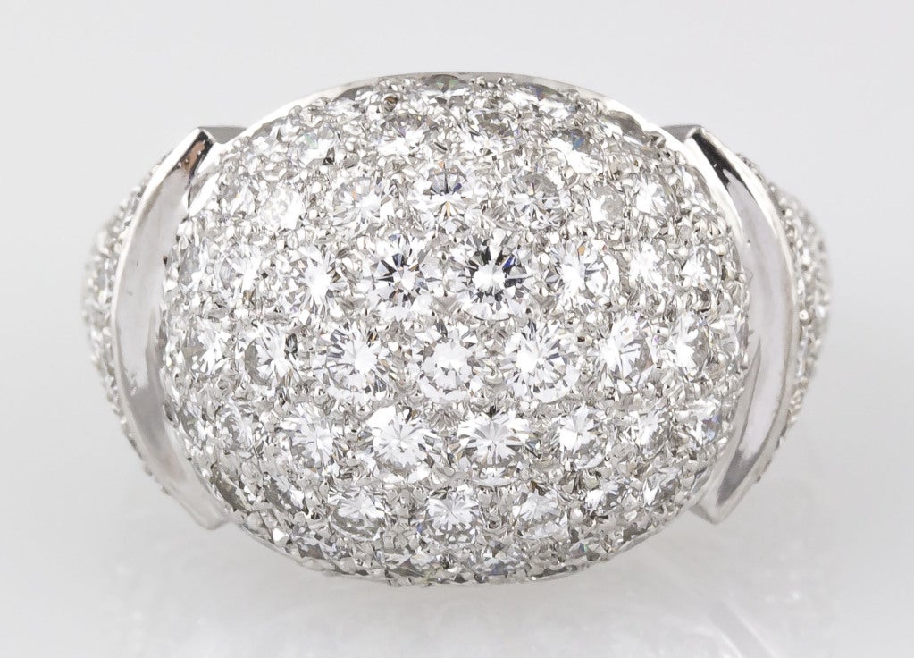 Rare and unusual 18K white gold and diamond dome ring by Cartier. It features very high grade round brilliant cut diamonds totaling approx. 4.5-5.0 cts. European size 54.
Hallmarks: Cartier, reference numbers, maker's mark, French 18K gold assay