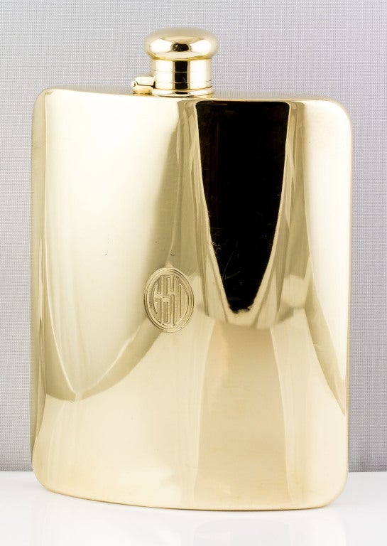 Rare and unusual solid 18K yellow gold flask by Tiffany & Co., circa 1920s-1930s. It is particularly rare because of its size, and because it's made of solid 18K gold, as opposed to silver or lower gold content. 
Hallmarks: Tiffany & Co., reference