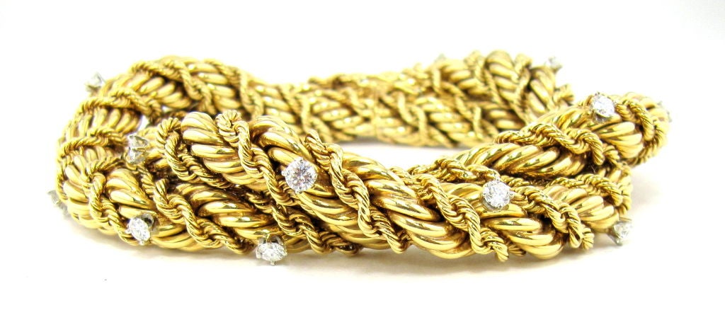 Rare and impressive 18K gold and diamond double-rope bracelet by Tiffany Schlumberger. This bracelet is a one-of-a-kind as told to us by the Schlumberger director at Tiffany NYC. The bracelet features a twisted dual-rope design with single button