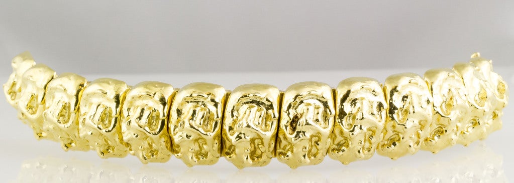 Bold and unusual 18K yellow gold heavy link bracelet by David Webb. Each individual piece in the likeness of gold nuggets. Overall weight a substantial 121.5grams. 
Hallmarks: Webb, 18K.