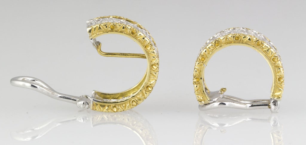 Chic and elegant 18K yellow gold and diamond huggies earrings, by Mario Buccellati. These have the trademark lattice design with two yellow gold half rings around it, in typical Buccellati fashion.Hallmarks:  M. Buccellati, Italy, 750, Italian marks.