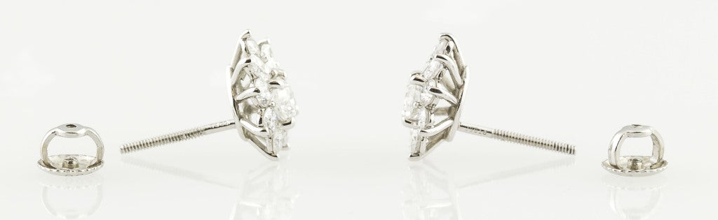 Charming platinum and diamond cluster earrings from the 