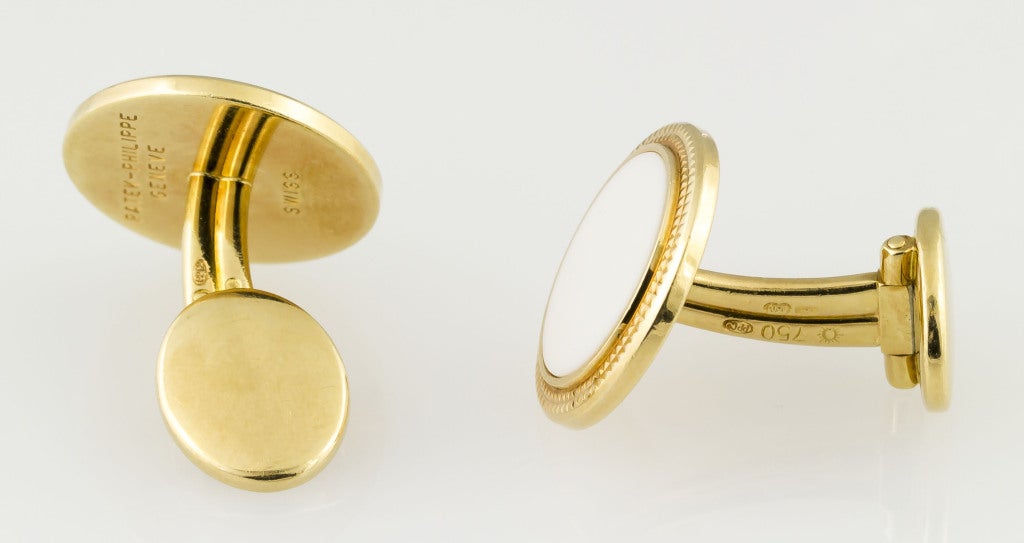 Highly desirable 18K yellow gold and white porcelain round cufflinks from the 