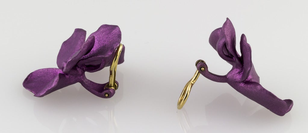 Rare and unusual titanium earrings with 18K yellow gold backs, by JAR (Joel Arthur Rosenthal). They resemble purple pansy blossoms.
Hallmarks: Jar, 750, maker's mark.