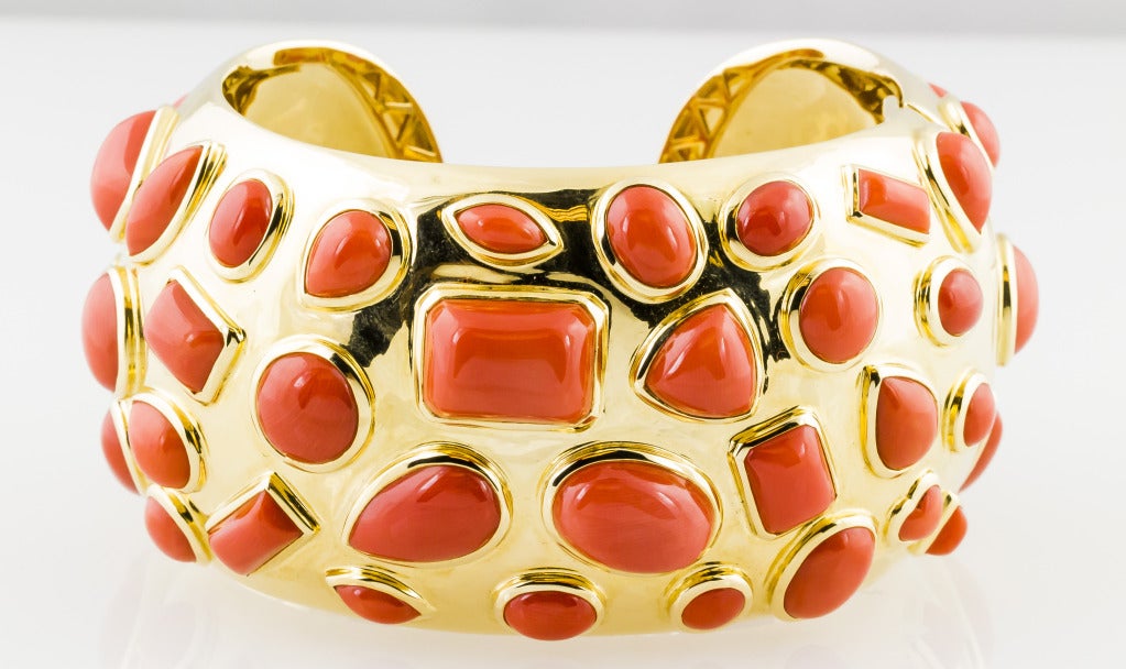 Chic and unusual yellow gold and coral cuff bracelet, from the 