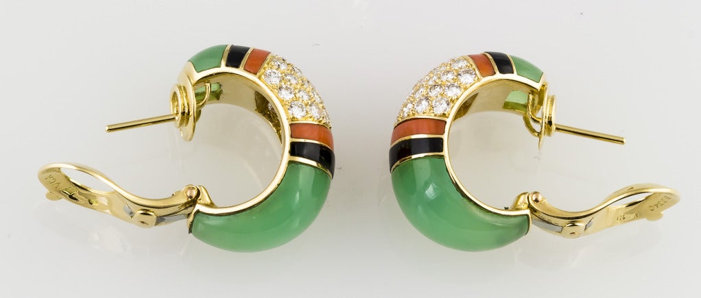 Beautiful, rare and unusual 18K gold, diamond, onyx and chrysoprase hoop earrings by Van Cleef & Arpels, of French origin. They feature classic Art Deco colors, in a revival style featuring not only colors, but also materials typical of the era. In