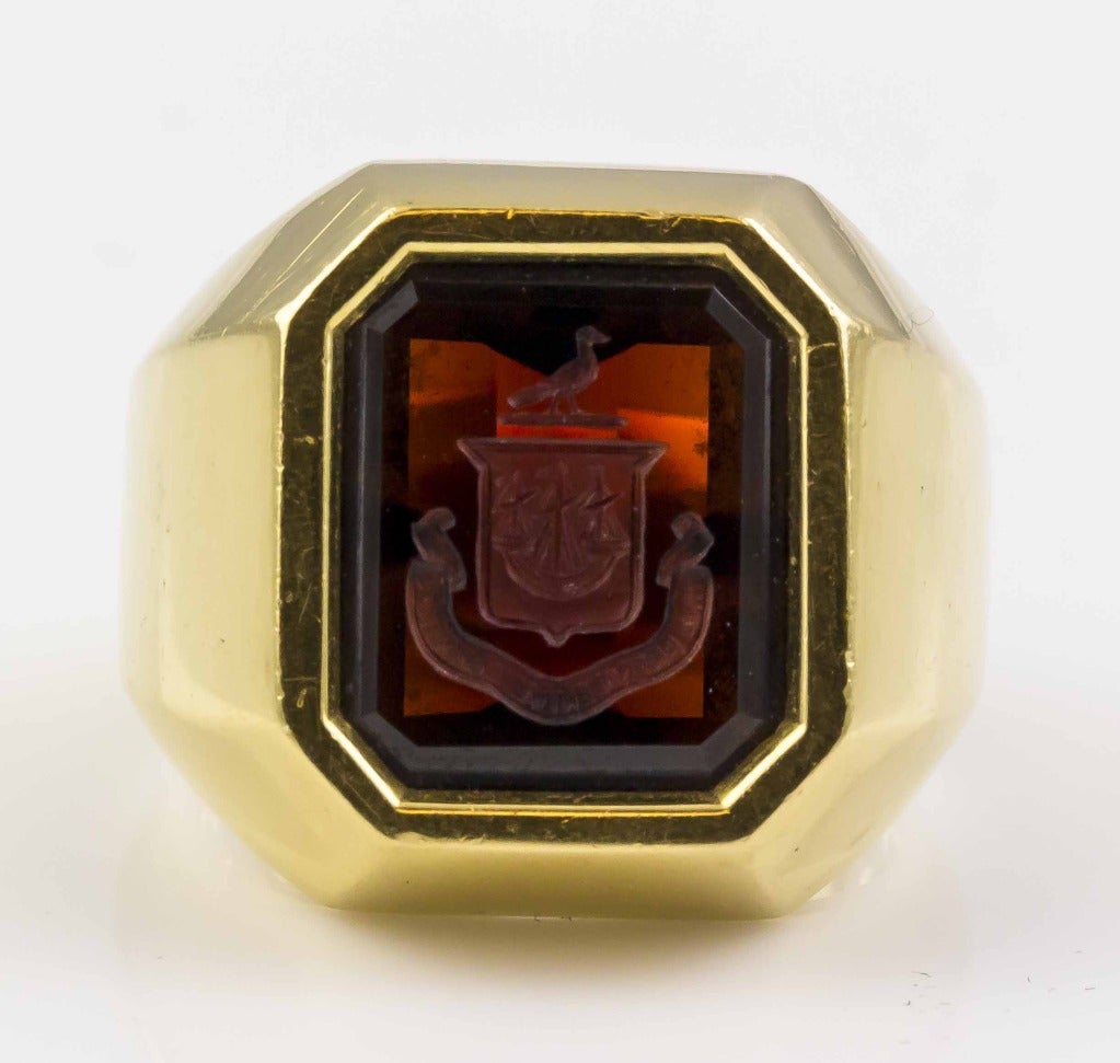 Handsome mans 18K yellow gold and garnet signed ring by Tiffany & Co., circa 1960s. In excellent condition.  Size 9.5 (could easily be altered up or down).  Hallmarks:  Tiffany & Co., 18K.