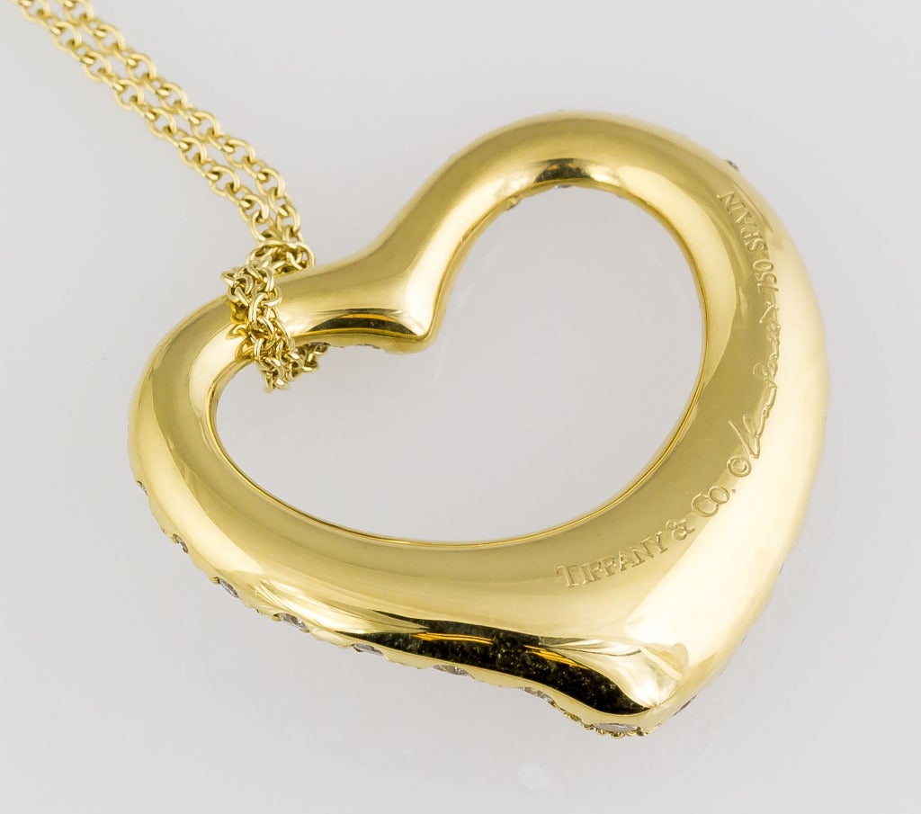 Charming 18K yellow gold and diamond pendant necklace from the 