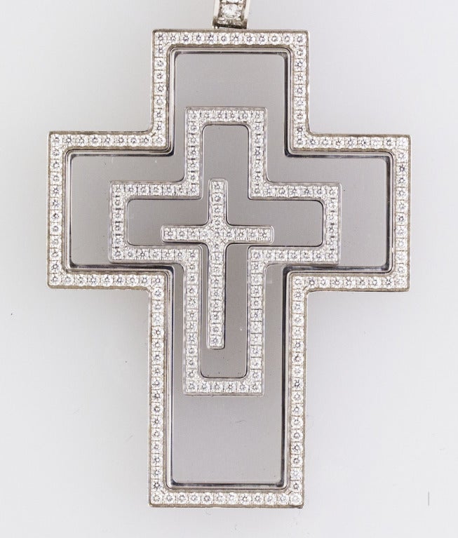 Chic and impressive 18K white gold and diamond cross pendant from the 