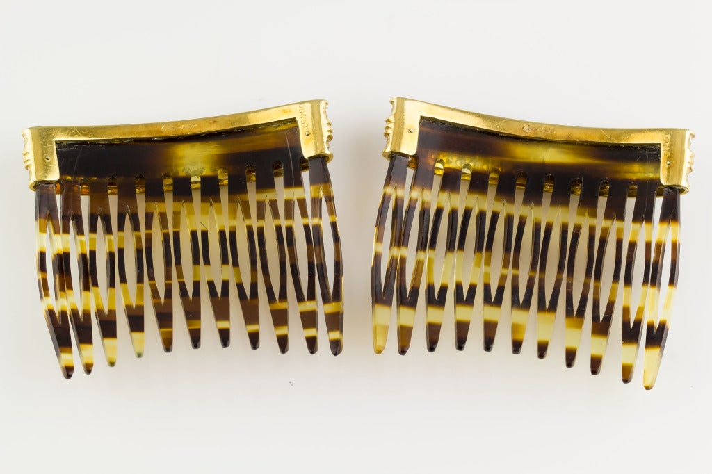 Very rare and unusual pair of diamond, platinum, 18K yellow gold and faux turtoise shell hair combs by Cartier, circa 1940s-50s. They feature very high grade round brilliant cut diamonds of approx 5-6 carats in total weight, set in platinum. Very