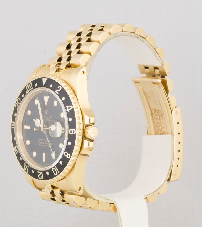 Highly sought after Rolex 18k yellow gold GMT-Master wristwatch. It features a sapphire crystal and quickset date. Automatic movement. Comes with Rolex 18k yellow gold Jubilee bracelet with deployant clasp.