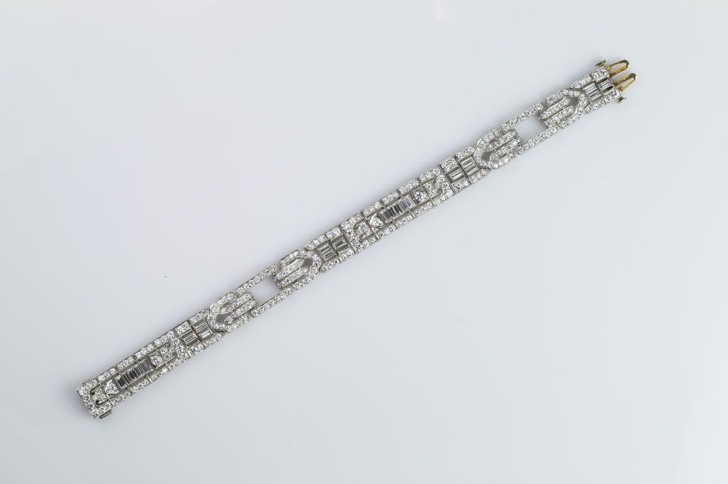 Chic & impressive Art Deco platinum and diamond bracelet, circa 1920s. It features approx. 12-13cts of high quality brilliant round cut and baguette cut diamonds. The bracelet was made during the latter part of the Art Deco period, because its lines