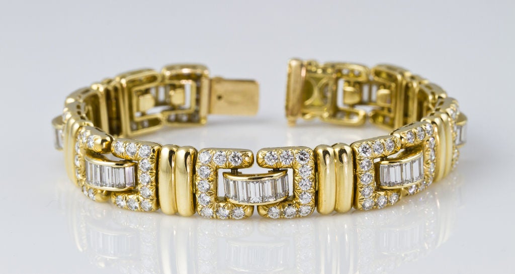 Elegant 18k yellow gold and diamond bracelet, by Tiffany & Co.  This bracelet is of French origin and most likely has never been retailed in the United States.  It features 126 round cut diamonds of approx. 5.5 carats, and 49 baguette cut diamonds