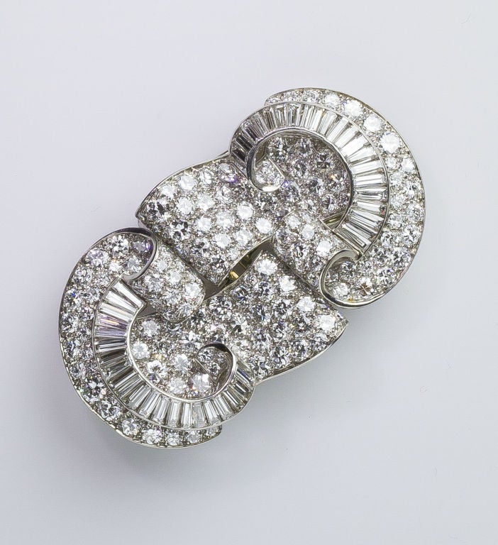 Magnificent platinum and diamond double-clip brooch from the Art Deco (1920s) era, of French origin.  This stunning brooch can be worn as a single impressive piece or two separate clips.  The brooch is set with approx. 17.0-18.0 carats of high