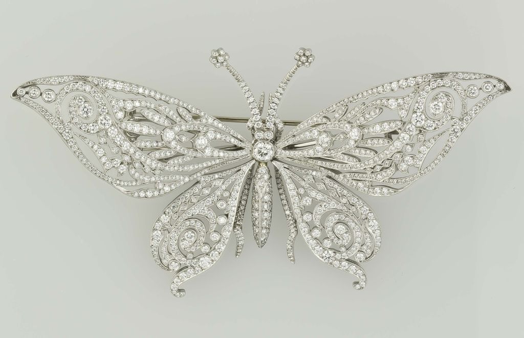 Bold and beautiful Platinum and diamond butterfly brooch pin by Tiffany & Co. It features great attention to detail and an intricate combination of high grade round cut diamonds of varying sizes, with the largest right in the middle, totaling